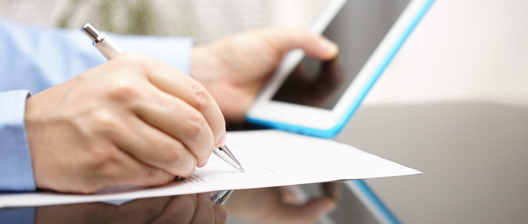 writing on form with tablet