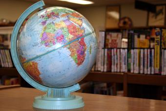 Globe with books behind library